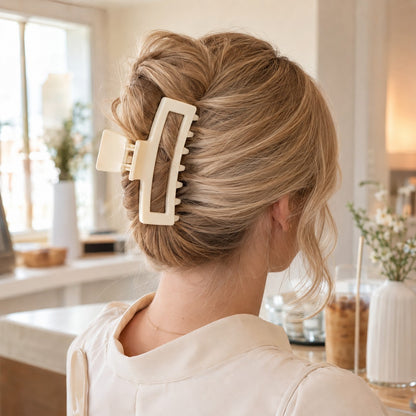 Blonde updo held in place with the ivory ClipLuxe claw clip