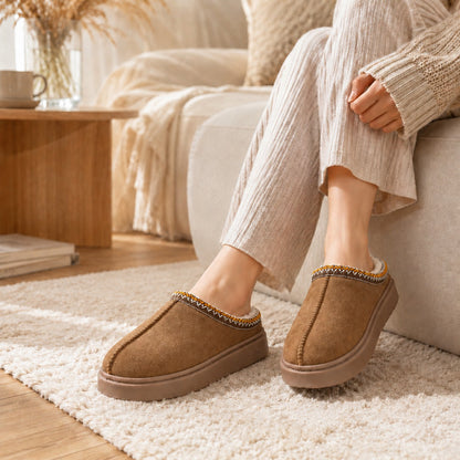 Khaki slippers relaxing on sofa