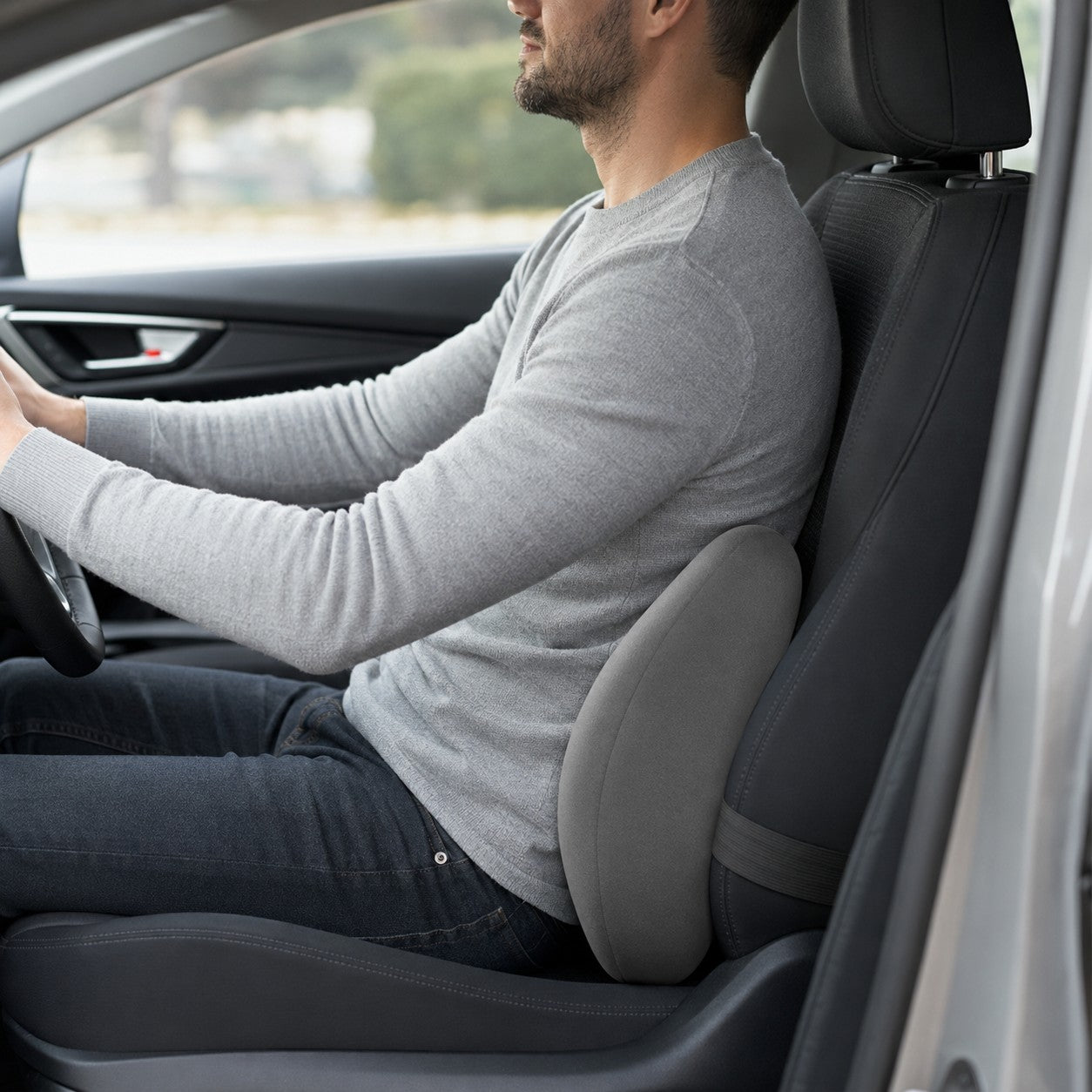 Driver using the ComfyRide lumbar cushion for back support