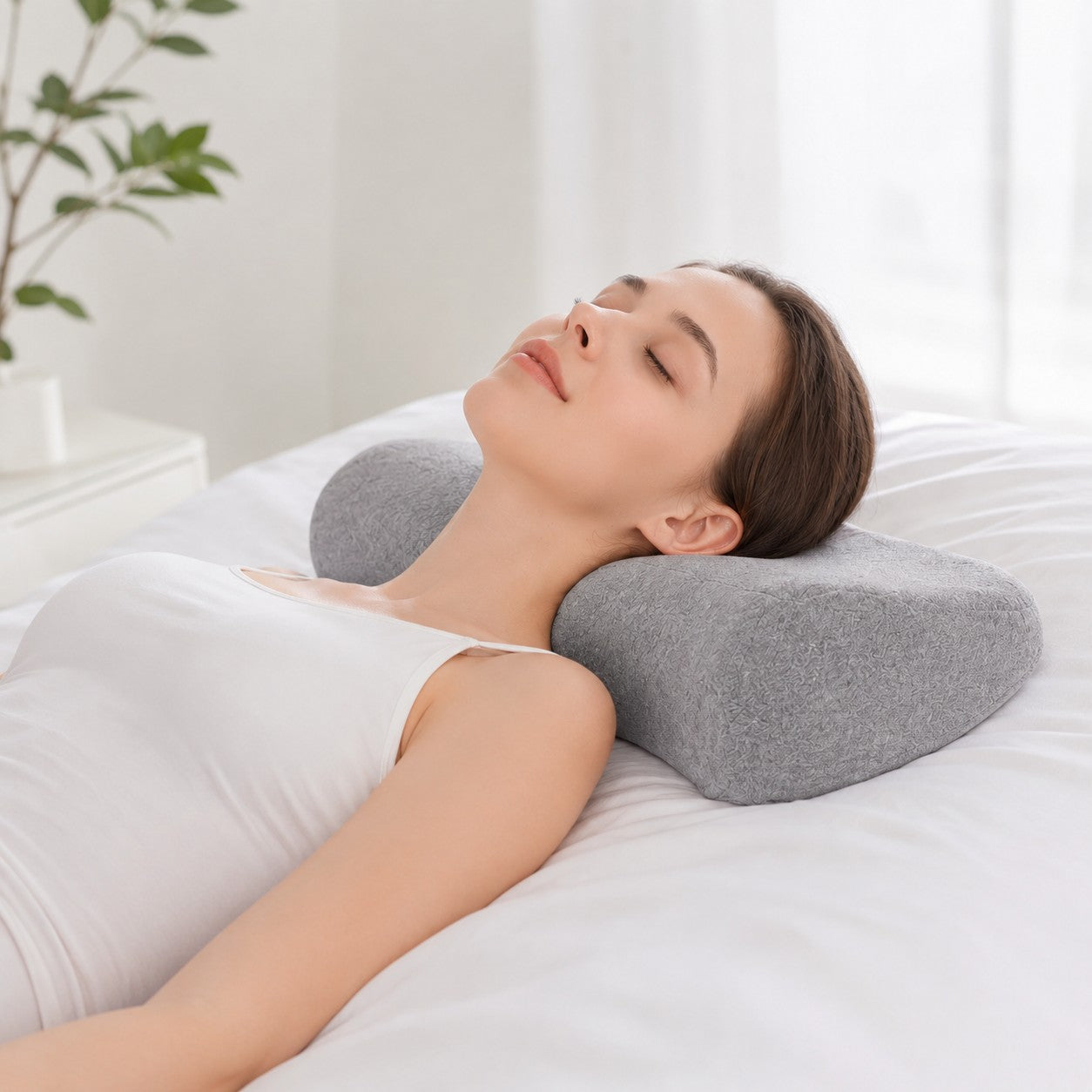 Woman sleeping on cervical pillow