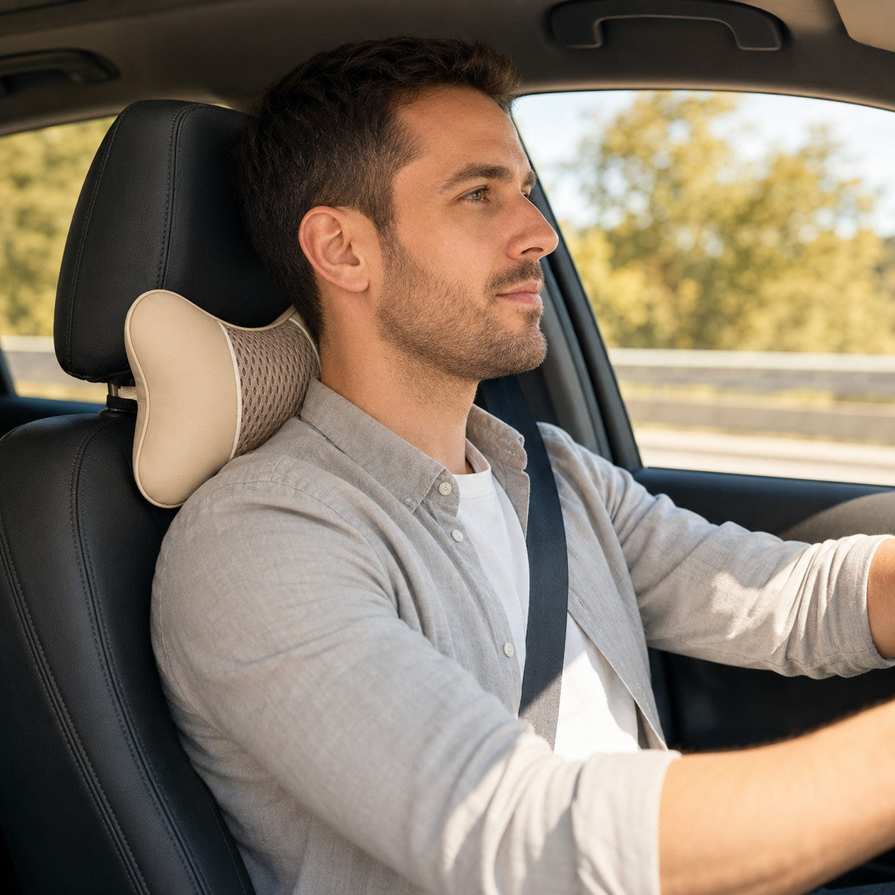 Driver using the beige DriveRest neck pillow