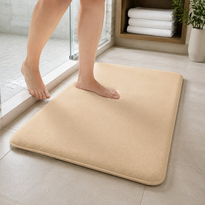 Stepping onto the beige DrySoft bath mat