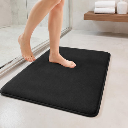 Stepping onto the black DrySoft bath mat