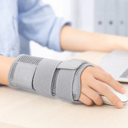Wearing the grey FlexWrist brace while typing