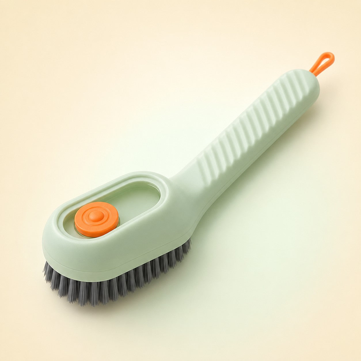 FoamGlide soap-dispensing cleaning brush in green