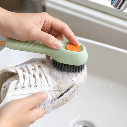 Close-up of the FoamGlide brush cleaning a white shoe