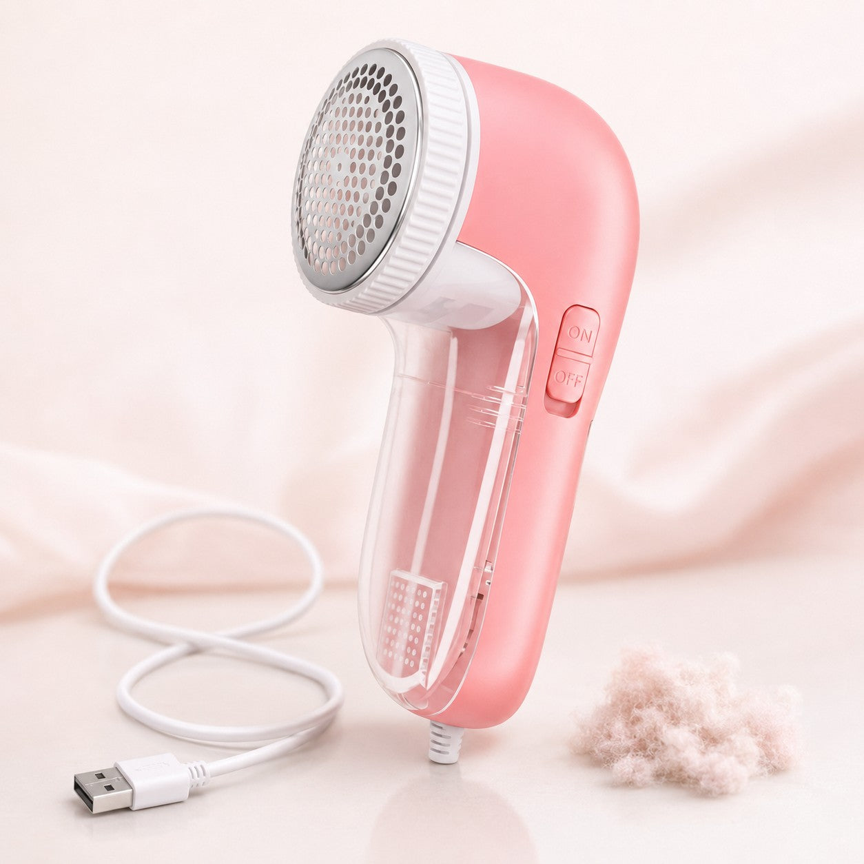 FuzzAway electric fabric shaver and lint remover in pink