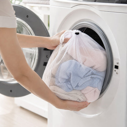 Loading the MeshGuard laundry bag into the washing machine
