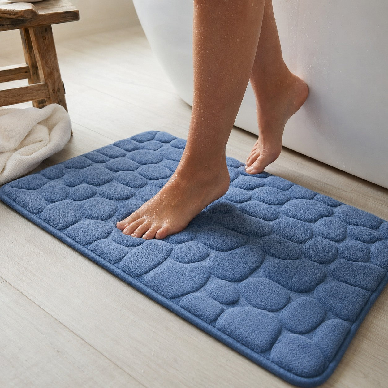 Standing on the blue NoSlip bath mat