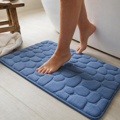 Standing on the blue NoSlip bath mat