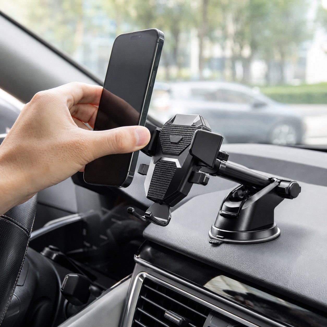 Placing a phone into the RoadView car phone holder on the dashboard