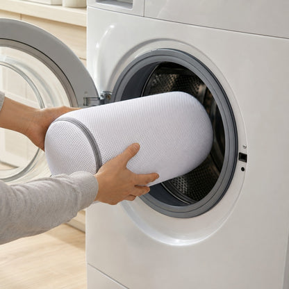 Loading the RollWash shoe bag into the washing machine