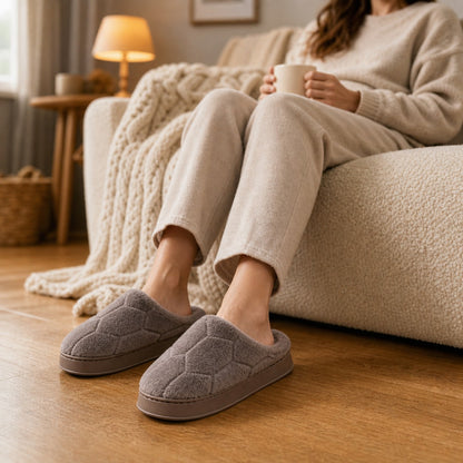 Relaxing on the couch in the gray SnugHome slippers