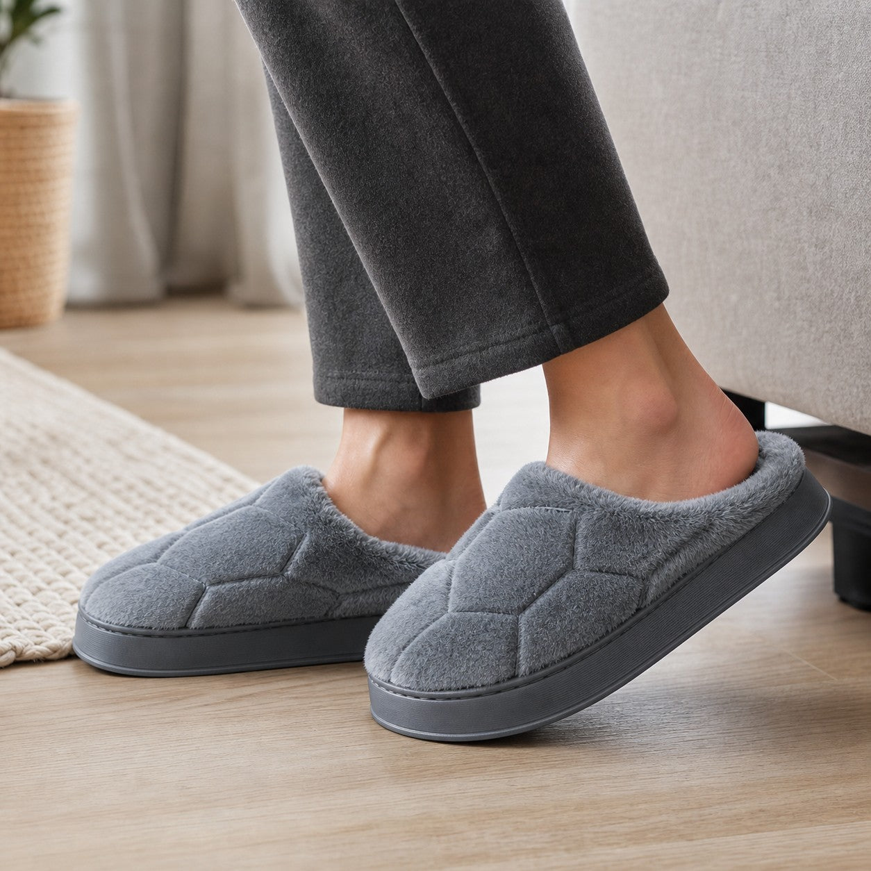 Close-up wearing the gray SnugHome house slippers