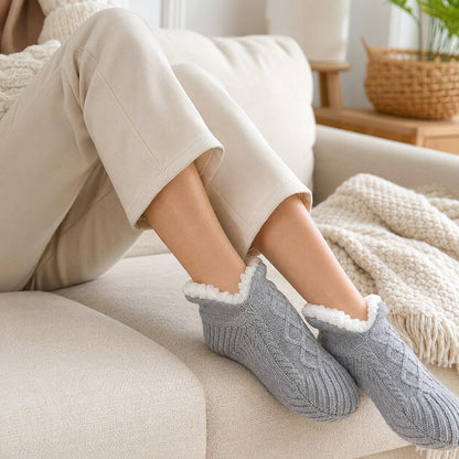 Close-up wearing the gray SnugSole thermal slipper socks at home