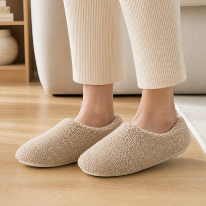 Close-up wearing the khaki SnugStep cosy slippers at home