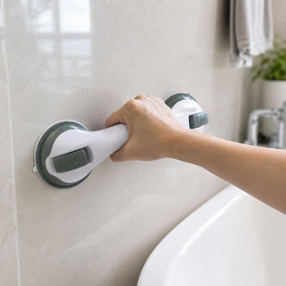Gripping the SteadyGrip grab bar mounted on a bathroom wall