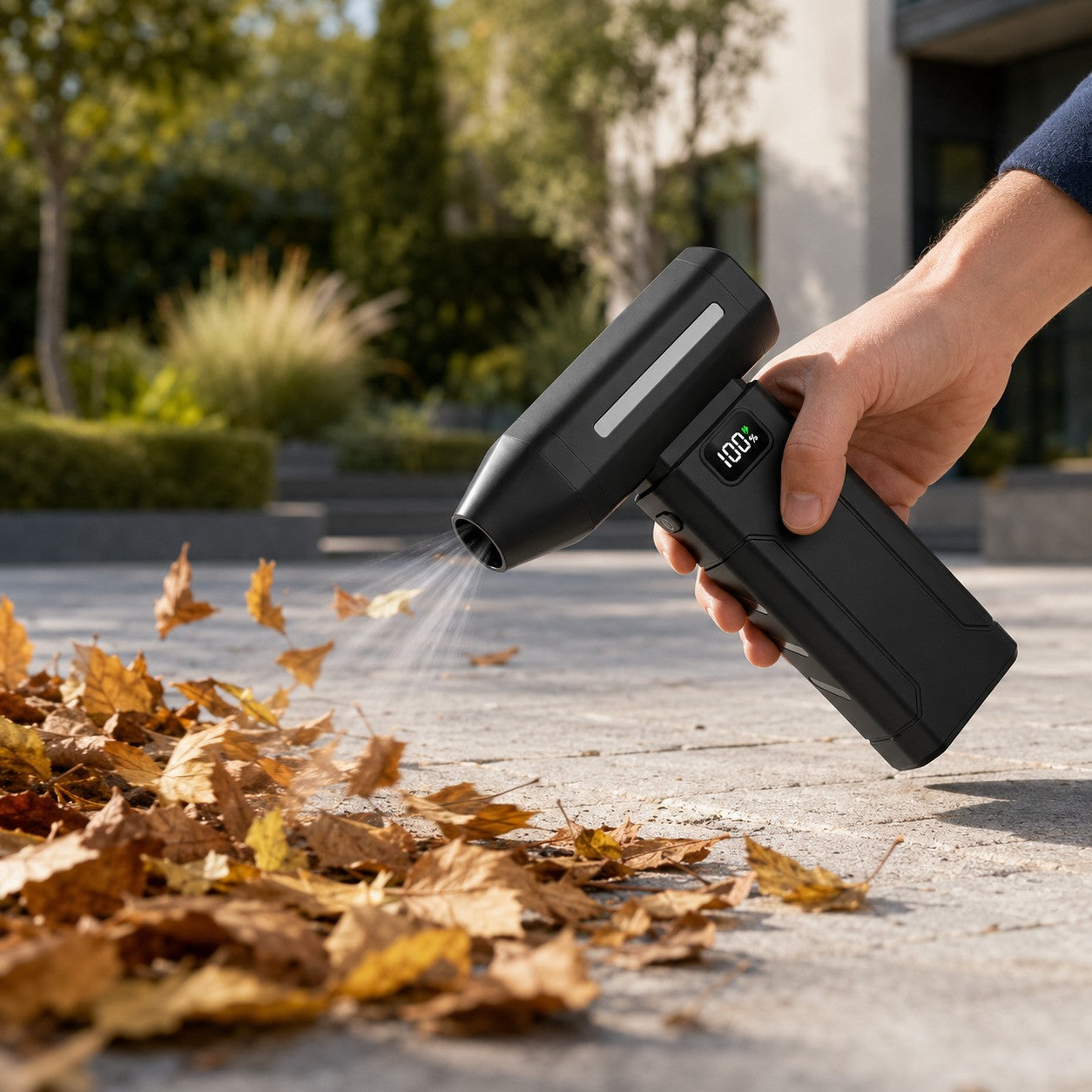 Blowing leaves off a path