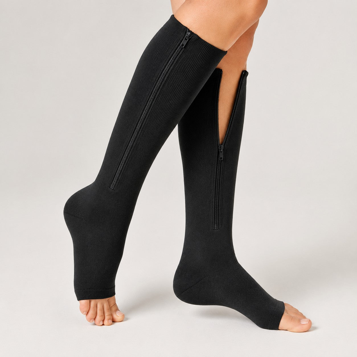 Black open-toe zipper compression sock detail